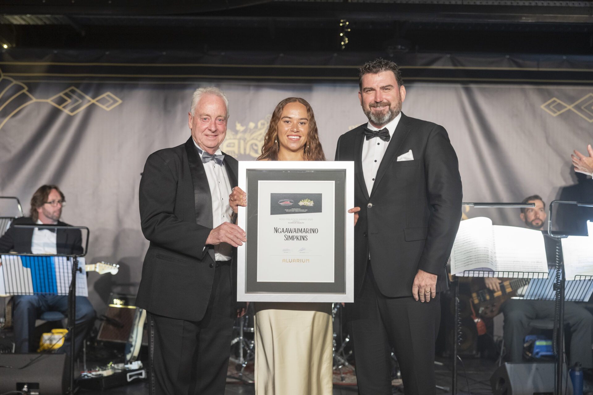 Ngaawaimarino Simpkins receiving the 2025 AIMES Ross Finlayson Award sponsored and presented by Alvarium