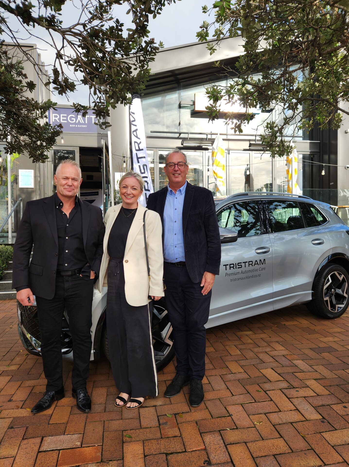 Rodney Gillard, Jem Taylor, and Mark Hayward from Tristram in front of Regatta Bar & Eatery for BEN Breakfast with Dame Susan Devoy